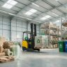 Warehouse with eco-friendly sustainable packaging materials and recycling symbols