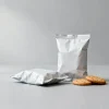Concept visual of biscuit pouches in two formats, rollstock pillow pack and premade stand-up pouch, used to illustrate cookie packaging format selection