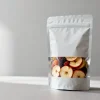 Stand-up dried fruit packaging pouch holding mixed dried fruit and apple chips